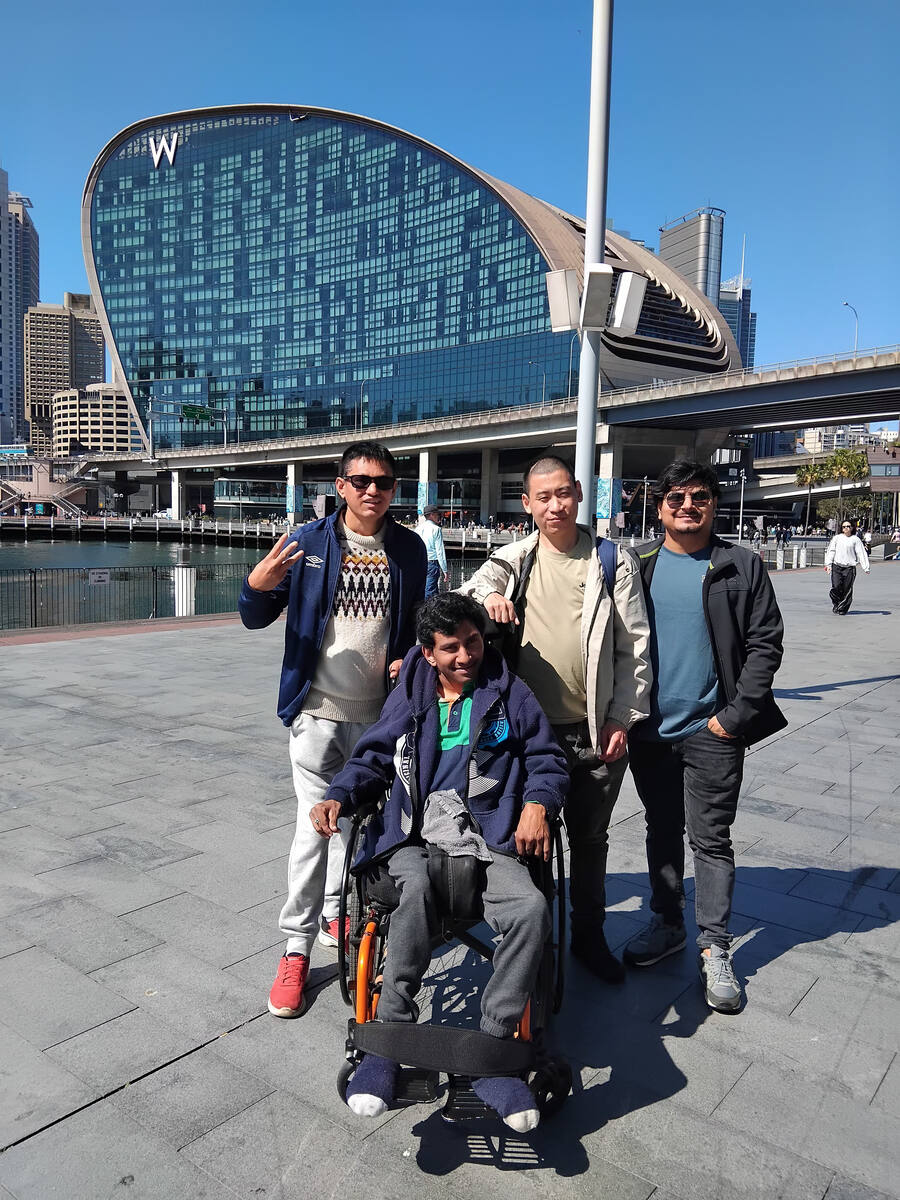 Enable Hub team member helping a participant at Darling Harbour