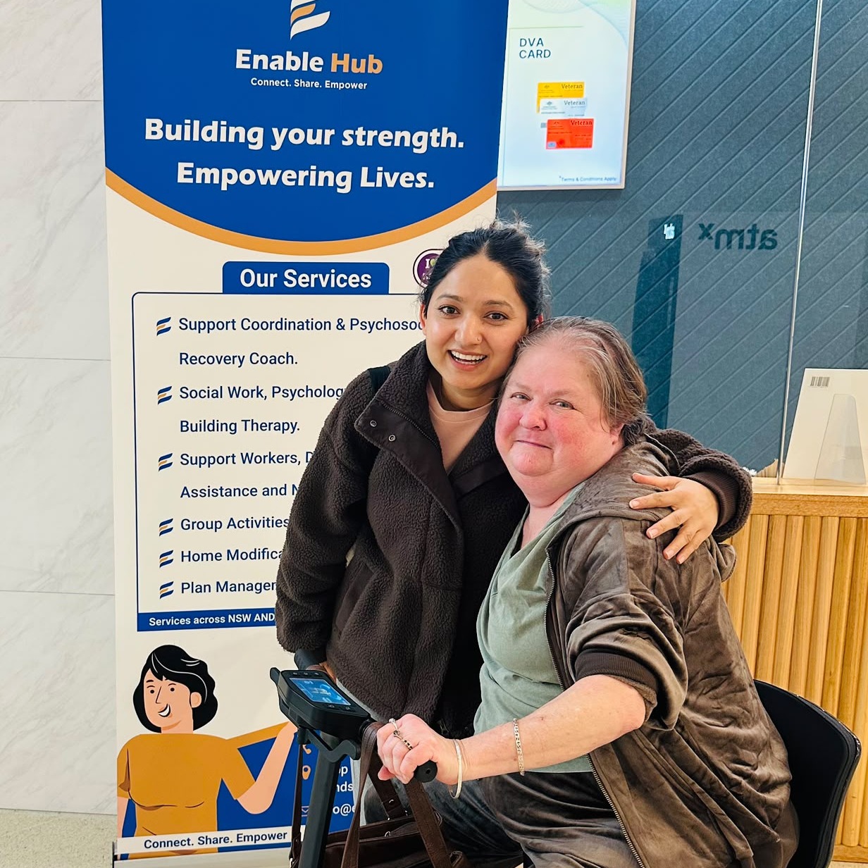 Enable Hub support worker with a participant at a community event